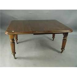 A Victorian mahogany extending dining table