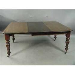 A Victorian mahogany extending dining table