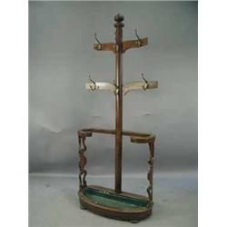A Victorian oak hallstand with brass hooks and fret cut shaped side supports Est.200/40