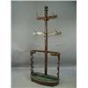 Image 1 : A Victorian oak hallstand with brass hooks and fret cut shaped side supports Est.200/40