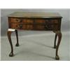 Image 1 : A mahogany bowfront two drawer cutlery table with cabriole legs and claw and ball feet