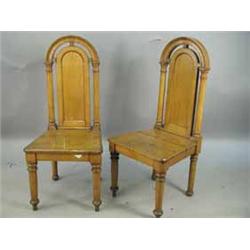 A pair of Victorian oak hall chairs with high arched backs Est.200/40