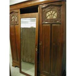 A walnut triple wardrobe