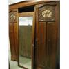 Image 1 : A walnut triple wardrobe