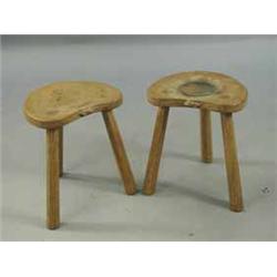 A pair of 'Mouseman Thompson' oak stools of kidney shape on chamfered legs