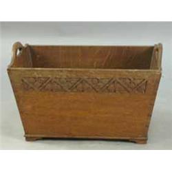 An Arthur W. Simpson oak magazine rack
