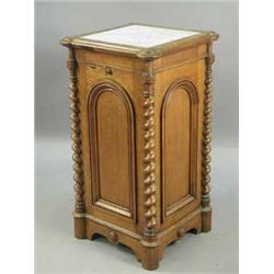 A Victorian oak pot cupboard the top with a marble inset over a single door