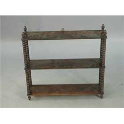 A set of l9th Century rosewood wall shelves with bobbin turned supports and acorn finials