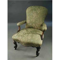 A Victorian carved walnut open armchair Est.500/80
