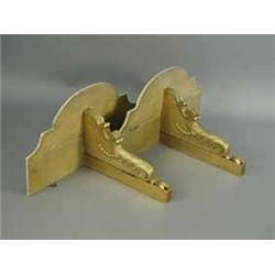 A pair of wall brackets each with faux marble top