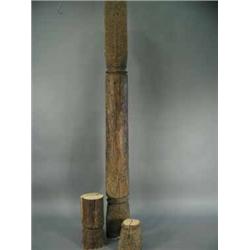 A tall early 20th Century Middle Eastern carved softwood post with associated pieces