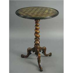 A Victorian walnut games table