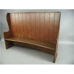 A 19th century Welsh curved pine settle with a painted finish and shaped ends