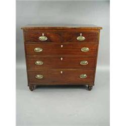 A Regency mahogany chest of drawers with ivory escutcheons and later brass handles