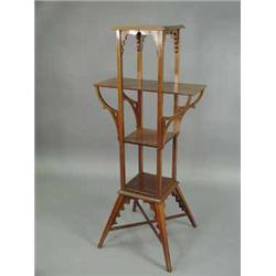 An Arts & Crafts mahogany four tier torchere