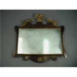 A mahogany wall mirror with gilt mounts