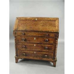 A 19th century provincial solid burr elm and yew wood bureau