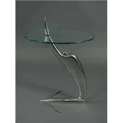 An Art Deco chrome and glass coffee table