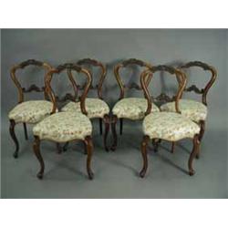 A set of six Victorian walnut dining chairs