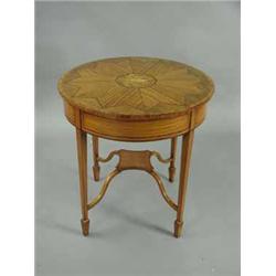 An Edwardian inlaid satinwood circular centre table