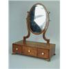 Image 1 : A George III mahogany oval toilet mirror