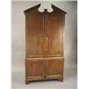Image 1 : A George III oak cupboard with an architectural cornice over four panelled doors on bracket feet