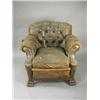 Image 1 : A South African leather upholstered arm chair on carved paw feet