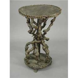 A Victorian lamp table with a gnarled root base