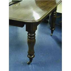 A Victorian mahogany extending dining table