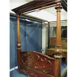 A mahogany four poster bed