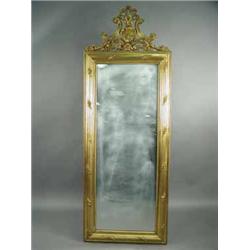 A 19th century gilt wall mirror with a carved crest