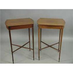 A matched pair of Edwardian strung mahogany lamp tables with hinged tops and 'D' shaped ends