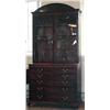 Image 1 : A large George III mahogany secretaire bookcase with dentil cornice above two astragal glazed doors,