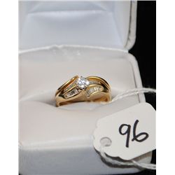 LADIES 14K YELLOW GOLD DIAMOND RING WITH ONE  ROUND FULL CUT CENTER DIAMOND AND TWENTY FOUR  CHANNEL