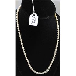 LADIES GRADUATED STRAND OF NATURAL PEARLS  WITH 14K YELLOW GOLD CLASP