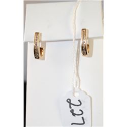 WOMANS DIAMOND EARRINGS WITH EACH EARRING  HAVING EIGHTEEN CHANNEL SET DIAMONDS - WEIGHS  3.0 GRAMS 