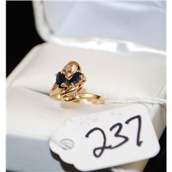 FANCY 14K YELLOW GOLD SAPPHIRE AND DIAMOND  RING WITH TWO MARQUISE CUT BLUE SAPPHIRES AND  ONE ACCEN