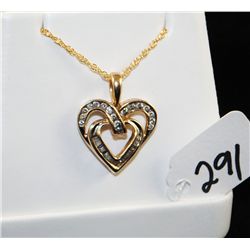LADIES HEART SHAPED DIAMOMD PENDANT WITH  ROUND AND BAGUETTE DIAMONDS SET IN 10K YELLOW  GOLD HEART 
