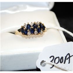 LADIES BLUE SAPPHIRE AND DIAMOND RING WITH  EIGHT MARQUISE CUT BLUE SAPPHIRES AND SIX  ROUND DIAMOND