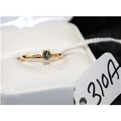VINTAGE BLUE TOPAZ AND DIAMOND RING WITH ONE  OVAL CUT BLUE TOPAZ CENTER AND SIX ACCENT  DIAMONDS SE