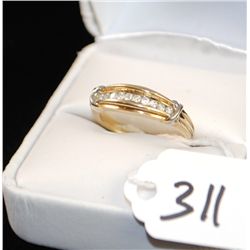 WOMANS CHANNEL SET DIAMOND RING WITH TEN  ROUND DIAMONDS SET IN 10K YELLOW GOLD RING -  WEIGHS 3.4 G