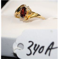 WOMENS GARNET AND DIAMOND RING WITH ONE OVAL  CUT GARNET AND TWO ACCENT DIAMONDS - WEIGHS  1.7 GRAMS