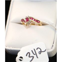 10K YELLOW GOLD RUBY AND DIAMOND RING WITH  ONE HEART SHAPED CENTER RUBY, TEN CHANNEL SET  BAGUETTE 