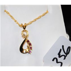 LADIES RUBY AND DIAMOND PENDANT WITH FOUR  ROUND RUBIES AND ONE ACCENT DIAMOND