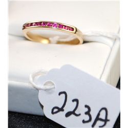 LADIES 14K YELLOW GOLD RUBY RING WITH ELEVEN CHANNEL SET RUBIES - WEIGHS 2.3 GRAMS - APPRAISED RETAI