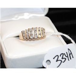 CHANNEL SET DIAMOND RING WITH 21 ROUND CHANNEL SET DIAMONDS SET IN 10K YELLOW GOLD RING - WEIGHS 4.0