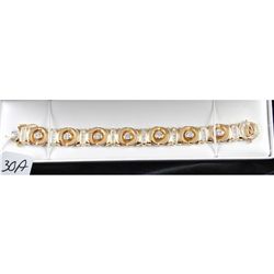 SPECTACULAR LADIES DIAMOND BRACELET - 14K YELLOW GOLD AND DIAMOND LINK BRACELET WITH SEVEN BEZEL SET