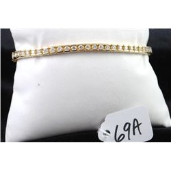 BEAUTIFUL LADIES 14K YELLOW GOLD DIAMOND TENNIS BRACELET WITH FIFTY FIVE ROUND FULL CUT DIAMONDS - A