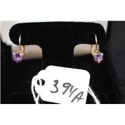 LADIES AMETHYST EARRINGS WITH TWO ROUND AMETHYSTS SET IN 10K YELLOW GOLD EARRINGS - LEVER BACKS