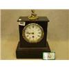 Image 1 : Late Victorian black marble mantel clock with cherub decoration £80 - 120...